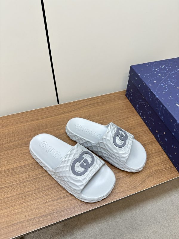 Gucci’s latest couple’s slip-flops silver A